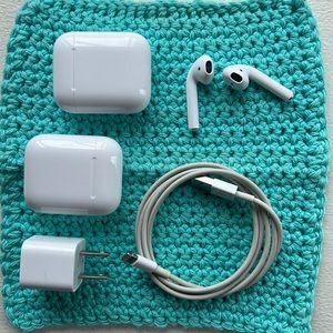 Apple AirPods with cases and charging cable